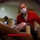 A radiation therapist prepares a patient for a CT scan